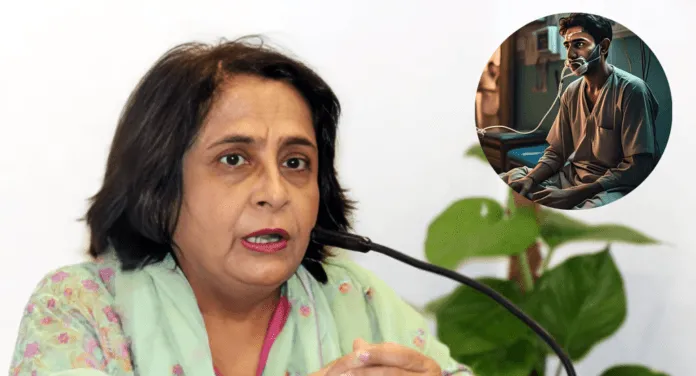A woman in traditional attire speaks at a podium, with a small inset showing a patient resting in a hospital setting.