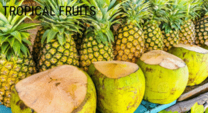Foods Not to Refrigerate: 15 items That your Storing Wrong 3 A vibrant display of pineapples and coconuts, showcasing the beauty of tropical fruits. The fruits are arranged neatly on a colorful surface.