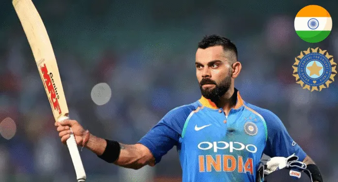 A cricketer in an India jersey raises a bat, celebrating a victory, with the Indian flag and cricket board logo in the background.