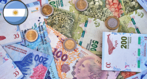 Top 13 Most Beautiful Banknote Designs Around the World 1 A collection of Argentine currency including various banknotes and coins, with the Argentine flag symbol in the upper left corner.