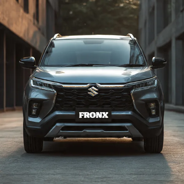 Front view of a grey Suzuki Fronx SUV parked in a narrow urban space, showcasing its sleek design and modern features. Suzuki Fronx Pakistan