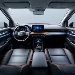 Sleek interior of a Suzuki car featuring modern dashboard, infotainment screen, leather seats, and stylish accents. Suzuki Fronx Specifications